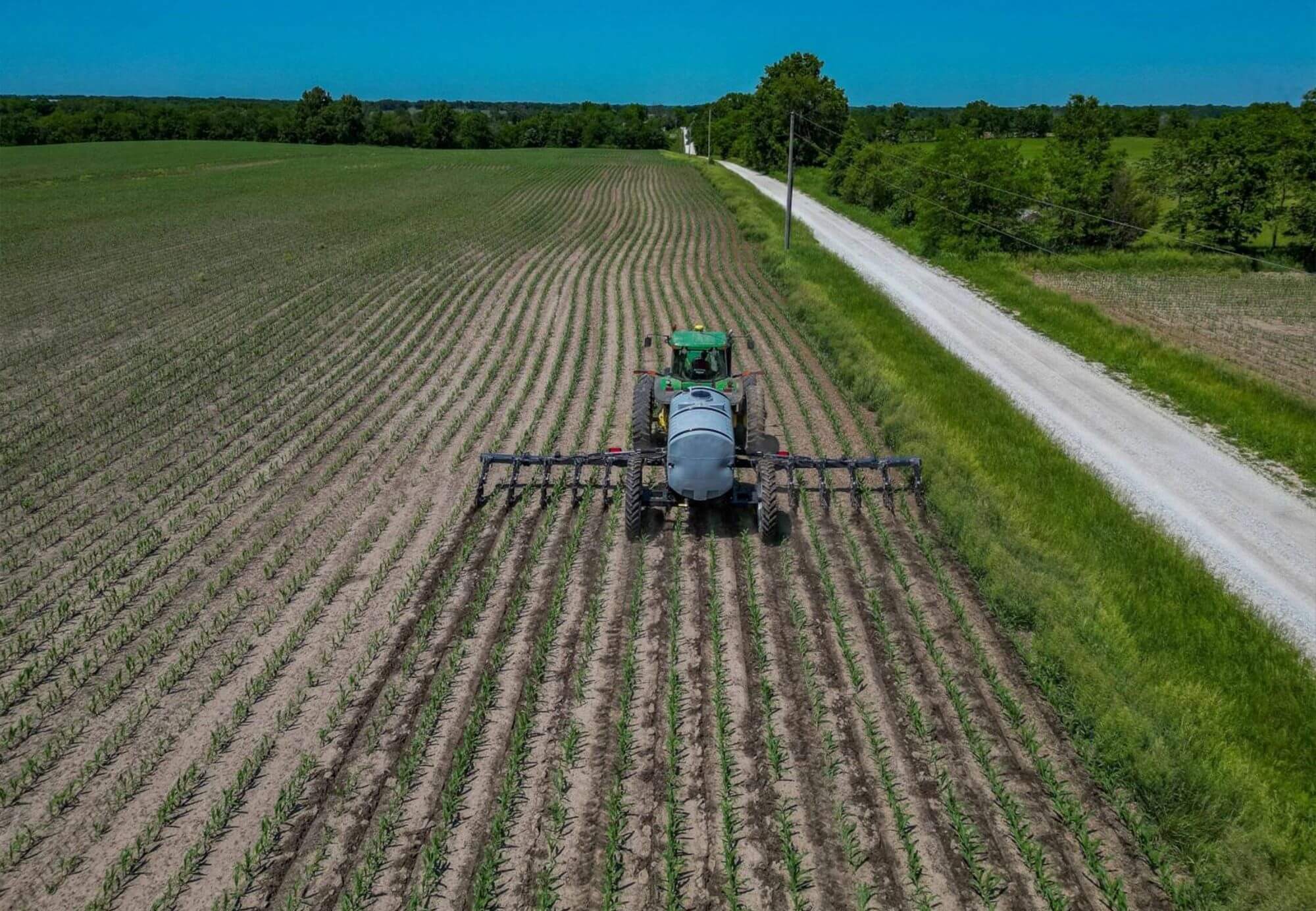 John Deere Tractor Fertilizing Field with Injection Applicator