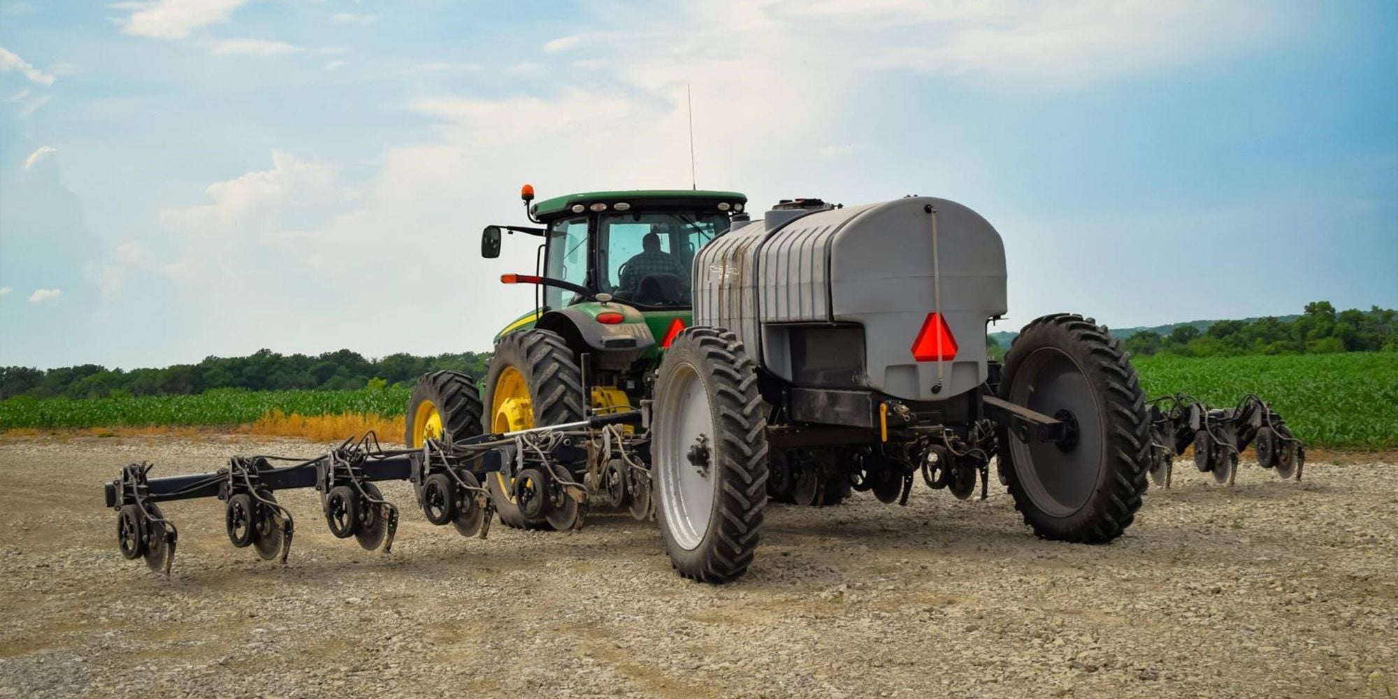 John Deere Tractor pulling Fertilizer Tank with Injection Applicator