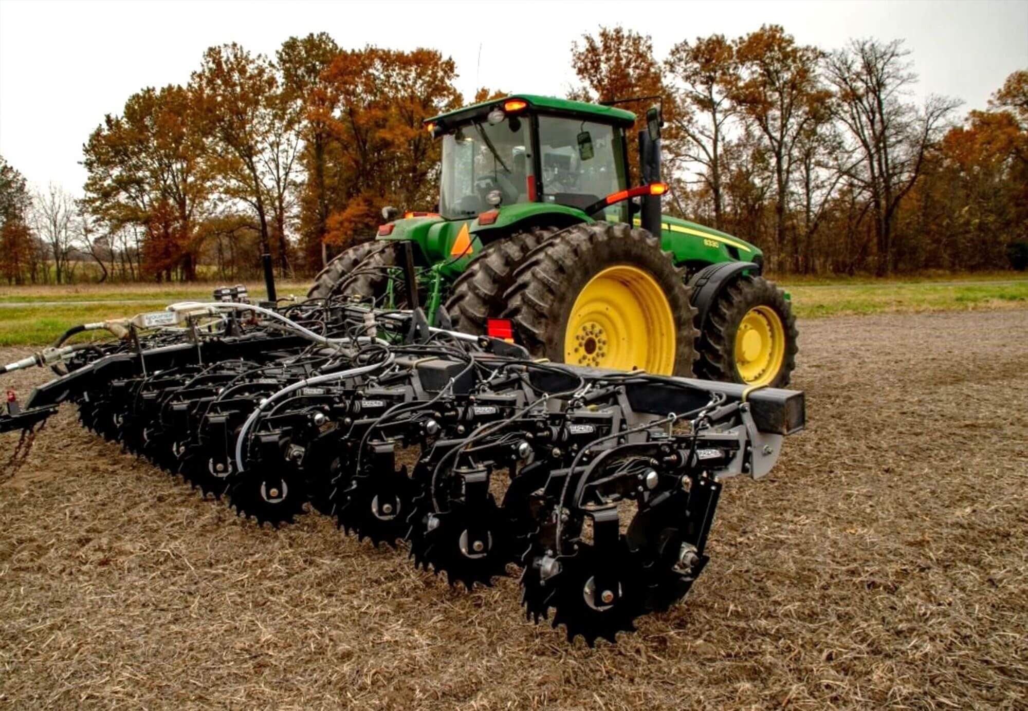 John Deere Tractor pulling Strip Till Disc Attachment